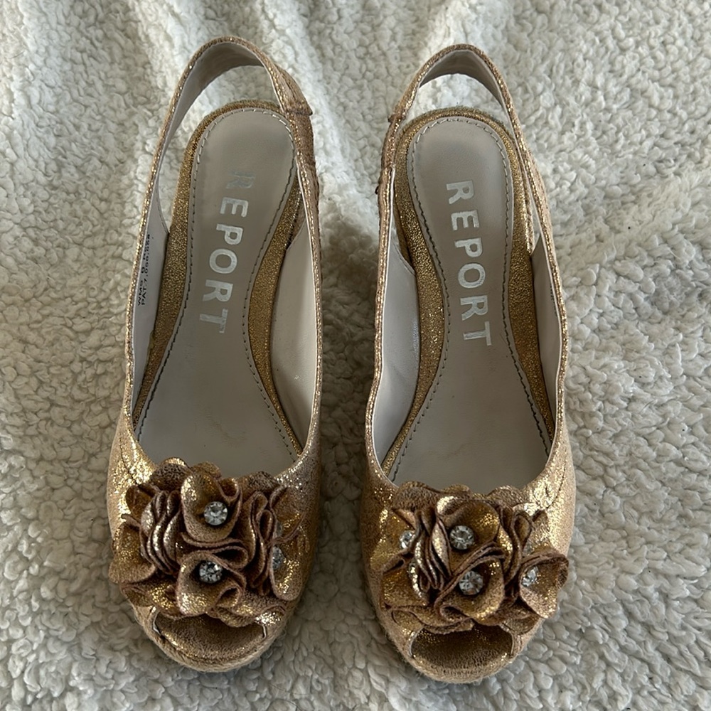 Gold wedge heels.